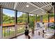 Inviting screened-in porch with comfortable seating and views of the backyard at 445 Brownell Ave, Scottdale, GA 30079