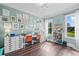 Bright bedroom with many windows, wood floors, custom art and bright lighting at 829 Christopher Rd, Sharpsburg, GA 30277