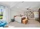 Large bedroom with neutral tones, a ceiling fan, a big window, and lots of decor at 829 Christopher Rd, Sharpsburg, GA 30277
