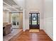 Elegant foyer featuring hardwood floors, a decorative front door, and wainscoting at 829 Christopher Rd, Sharpsburg, GA 30277