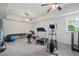 Home gym with a variety of exercise equipment and natural light at 829 Christopher Rd, Sharpsburg, GA 30277