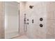 Spa-like tiled shower featuring multiple shower heads and modern fixtures at 829 Christopher Rd, Sharpsburg, GA 30277