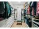 Spacious walk-in closet with custom shelving and ample storage space for clothes and accessories at 829 Christopher Rd, Sharpsburg, GA 30277