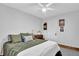 Cozy bedroom with natural light, wood floors, and traditional decor for a peaceful retreat at 1650 Tomahawk Trl, Cumming, GA 30041