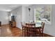 Cozy dining area features a round table, seating for four, and natural light at 1650 Tomahawk Trl, Cumming, GA 30041