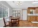 Charming kitchen nook with modern chandelier and natural light, perfect for casual dining at 1650 Tomahawk Trl, Cumming, GA 30041