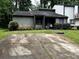 Traditional home with rock facade, black roof, and large driveway with greenery surrounding at 286 Toweridge Sw Dr # 3, Marietta, GA 30064