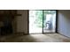 Spacious living room featuring a stone fireplace and sliding glass doors to the backyard at 286 Toweridge Sw Dr # 3, Marietta, GA 30064