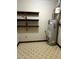 Water heater in an unfinished basement with shelving attached to walls at 286 Toweridge Sw Dr # 3, Marietta, GA 30064