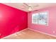 Bright bedroom with pink walls and a window offering natural light at 421 Old Ivy Path, Mcdonough, GA 30253