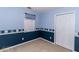 Cozy bedroom with blue walls and a window dressed with nautical accents at 421 Old Ivy Path, Mcdonough, GA 30253