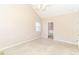 Spacious bedroom with neutral walls, plush carpeting, and natural light from a window at 421 Old Ivy Path, Mcdonough, GA 30253