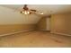 Versatile bonus room featuring neutral walls, plush carpeting, and a ceiling fan at 421 Old Ivy Path, Mcdonough, GA 30253