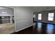 Open-concept space connecting the living room and dining area, featuring hardwood floors and natural light at 4827 Wyndam Dr, Stone Mountain, GA 30088