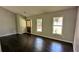 Inviting living room featuring hardwood floors and two windows allowing for natural light at 4827 Wyndam Dr, Stone Mountain, GA 30088