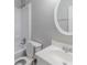 Bathroom with toilet and vanity with a sink at 5509 Covent Way, Lithonia, GA 30058