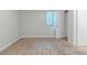 Empty bedroom features carpet, light grey walls and a window at 5509 Covent Way, Lithonia, GA 30058