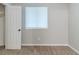 Neutral bedroom featuring plush carpet flooring, a window, and a closet with a white door at 5509 Covent Way, Lithonia, GA 30058