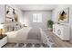 Bright bedroom featuring a well-lit space and neutral decor with tasteful accents and calming artwork at 5509 Covent Way, Lithonia, GA 30058