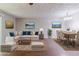 Staged living room showcasing an open floor plan, hardwood floors, and stylish decor at 5509 Covent Way, Lithonia, GA 30058