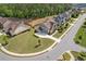 Stunning aerial view of a two-story home with a well-manicured lawn and a long driveway in a beautiful neighborhood at 1972 Clovercroft Rd, Acworth, GA 30101