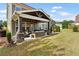 Large backyard with a covered patio and manicured lawn at 1972 Clovercroft Rd, Acworth, GA 30101