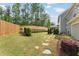 Backyard featuring a patio, lush greenery, and a privacy fence at 1972 Clovercroft Rd, Acworth, GA 30101