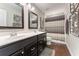 Bathroom featuring a double vanity and shower with a decorative curtain at 1972 Clovercroft Rd, Acworth, GA 30101