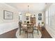 Dining room featuring dark wood floors, and decorative molding at 1972 Clovercroft Rd, Acworth, GA 30101