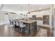 Spacious kitchen featuring an island with bar seating and stainless steel appliances at 1972 Clovercroft Rd, Acworth, GA 30101