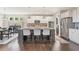 Beautiful kitchen featuring an island with bar seating and stainless steel appliances at 1972 Clovercroft Rd, Acworth, GA 30101