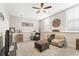 Relaxing living area includes comfortable seating, neutral decor, and plenty of natural light from the windows at 1972 Clovercroft Rd, Acworth, GA 30101