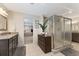 Stylish main bathroom boasts granite countertops, a glass-enclosed shower, and dark wood cabinetry at 1972 Clovercroft Rd, Acworth, GA 30101