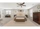 Bright and airy main bedroom features neutral decor, a ceiling fan, a large rug, and ample space at 1972 Clovercroft Rd, Acworth, GA 30101