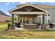 Well-appointed patio with comfortable seating and an outdoor grill at 1972 Clovercroft Rd, Acworth, GA 30101
