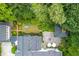Stunning aerial view of manicured backyard with lush greenery, stone patio, and seating areas creating a private oasis at 341 Lands Se Ml, Marietta, GA 30067