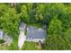 Aerial view of home with mature trees, driveway, and surrounding landscape at 341 Lands Se Ml, Marietta, GA 30067