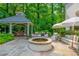 An elegant backyard features a gazebo, outdoor seating, and fire pit at 341 Lands Se Ml, Marietta, GA 30067