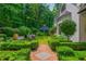 Manicured backyard with lush gardens, brick pathways, and gazebo at 341 Lands Se Ml, Marietta, GA 30067