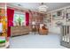 Brightly decorated Bedroom with patterned wallpaper, vibrant curtains, and built-in bookcases at 341 Lands Se Ml, Marietta, GA 30067