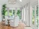 Bright sunroom dining area with tiled floors, floor-to-ceiling windows, and natural light at 341 Lands Se Ml, Marietta, GA 30067