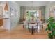 Dining room featuring a modern chandelier and seating for six, complemented by hardwood flooring at 341 Lands Se Ml, Marietta, GA 30067