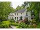 Stunning two-story home with a black door, pristine white exterior, and expertly landscaped front yard at 341 Lands Se Ml, Marietta, GA 30067