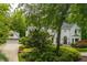 This home features a two-car garage and a meticulously maintained lawn and shrubbery, enhancing its appeal at 341 Lands Se Ml, Marietta, GA 30067