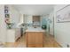Spacious white kitchen with a marble island, stainless steel appliances, and wooden accents at 341 Lands Se Ml, Marietta, GA 30067