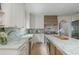 Modern kitchen featuring marble countertops, stainless steel appliances, and custom cabinetry at 341 Lands Se Ml, Marietta, GA 30067