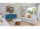 Bright living room featuring hardwood floors, a bay window, and stylish furnishings at 341 Lands Se Ml, Marietta, GA 30067