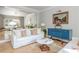 Bright living room featuring a white sofa, light hardwood floors, and stylish decor at 341 Lands Se Ml, Marietta, GA 30067