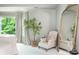 Bright bedroom with a decorative mirror, an accent chair, and natural light at 341 Lands Se Ml, Marietta, GA 30067