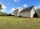 Spacious backyard featuring a large grassy area and a privacy fence at 617 Kyles Cir, Hiram, GA 30141